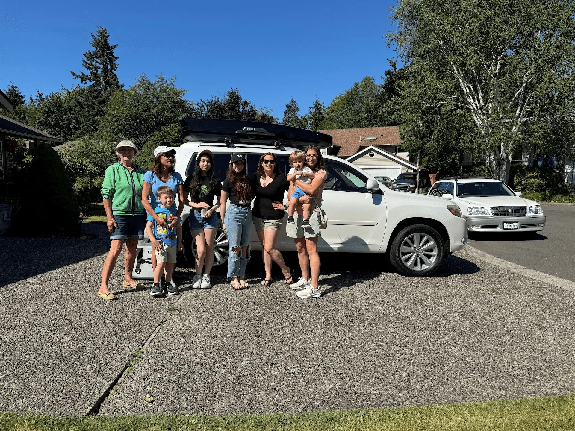 Family and relatives gathered beside the packed SUV before a road trip